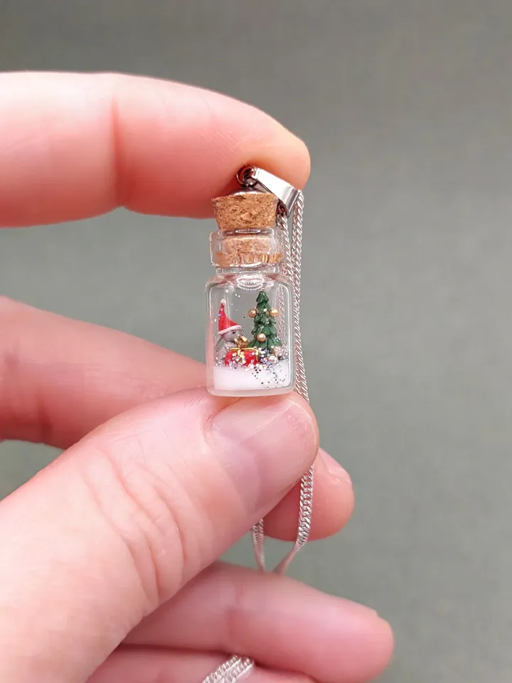 Pendant jewelry Christmas composition in a jar on a silver chain
