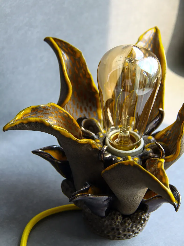 Altar table or witch starter kit can complement unique ceramic table lamp