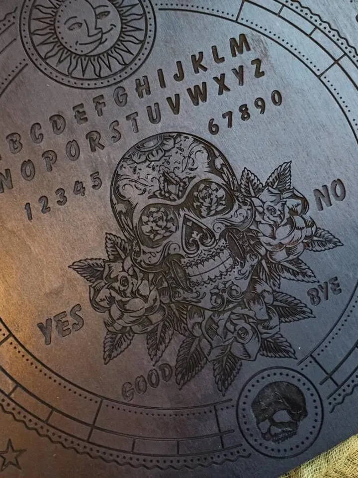 Ouija board , Spirit board , Occult art