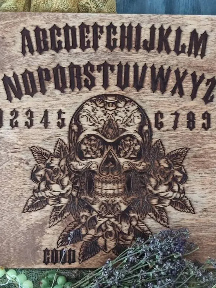 Divination board , ouija board , pendulum board , talking board , spirit board