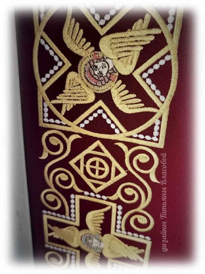 Cross with seraphim design for machine embroidery.