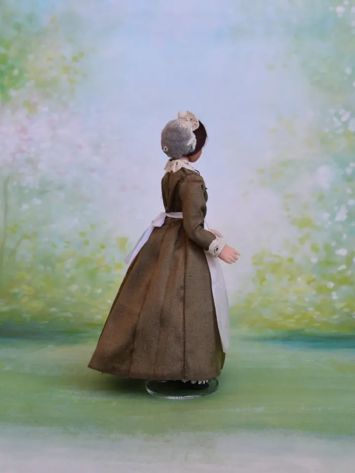 Miniature nanny doll for Victorian dollhouse in 1/12th scale.