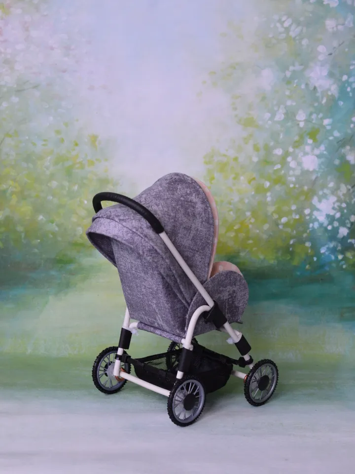 Miniature toy stroller for dolls in 1/6 scale. Accessories for small dolls and poupins. Pram for Barbie doll.