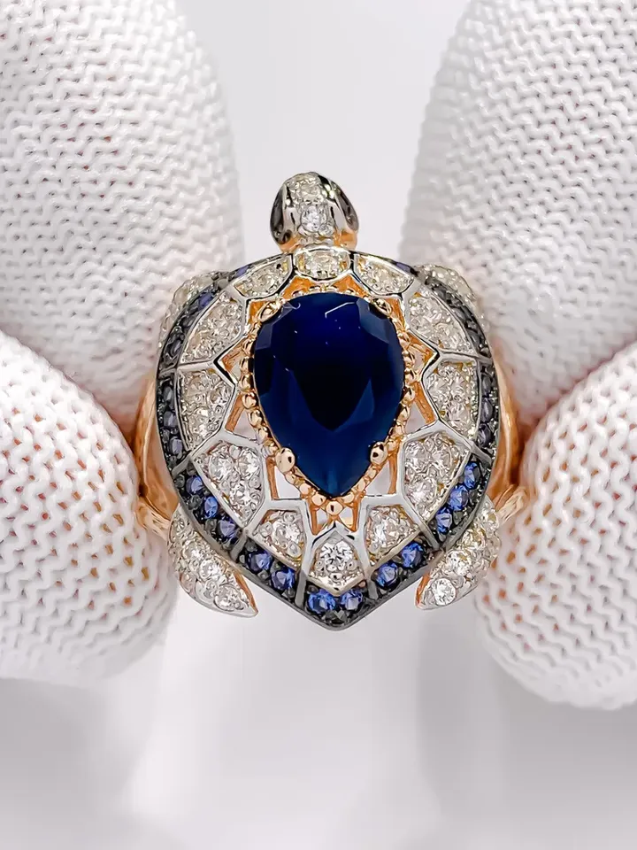 Ring Silver gold plated 925 assay value with sapphire