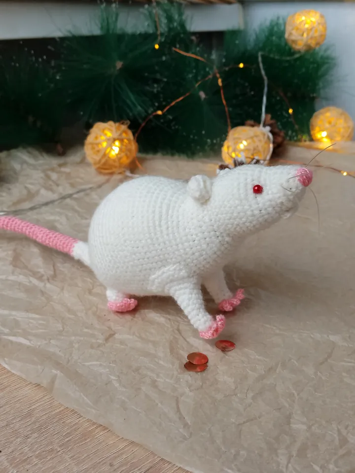 White mouse toy. Soft toy life-size white rat with red eyes.