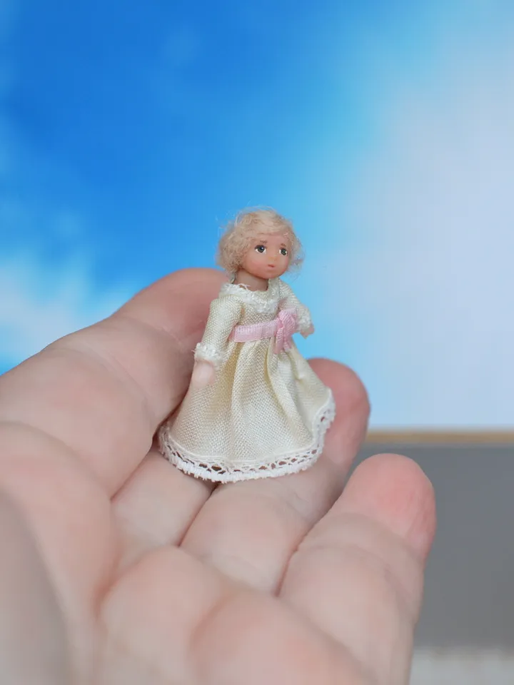 Miniature dolls in 24th scale. A grandmother with a baby for a dollhouse.