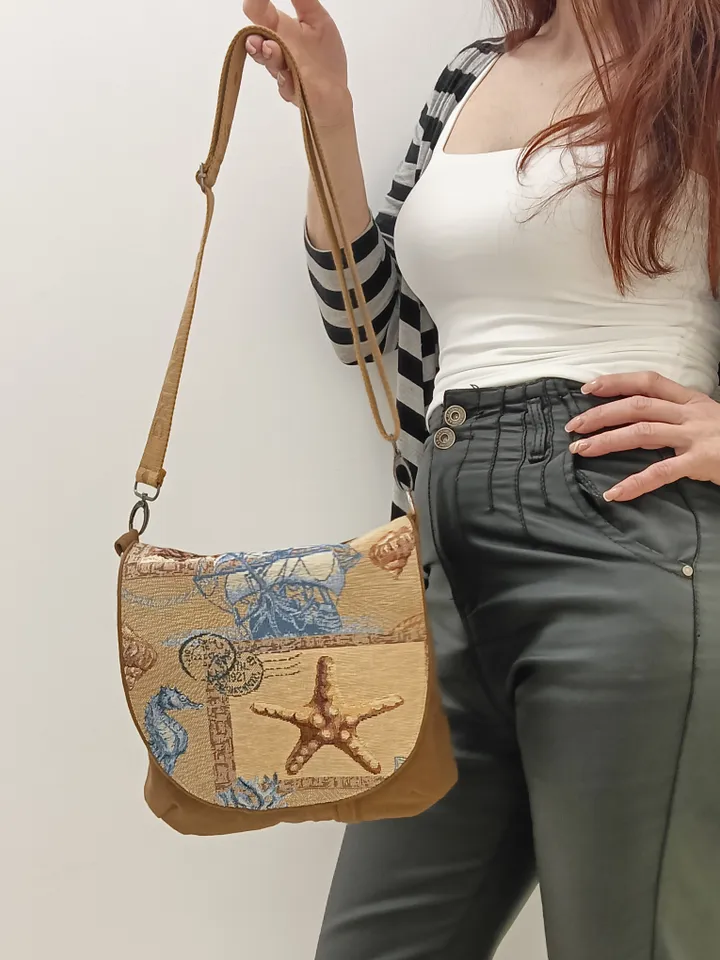 Brown crossbody /shoulder denim bag, a women's messenger bag with a tapestry flap with a marine theme pattern and denim shoulder bag with 4 pockets inside and an adjustable strap.