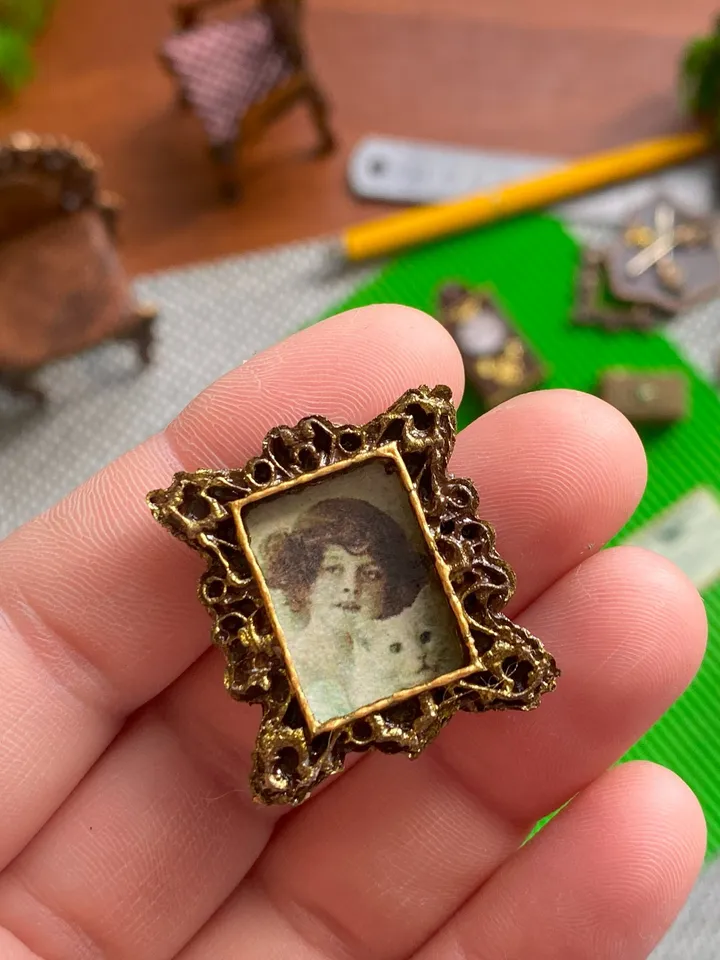 A set of photo frames for a dollhouse. Dollhouse miniature. 1:12. Dollhouse accessories.