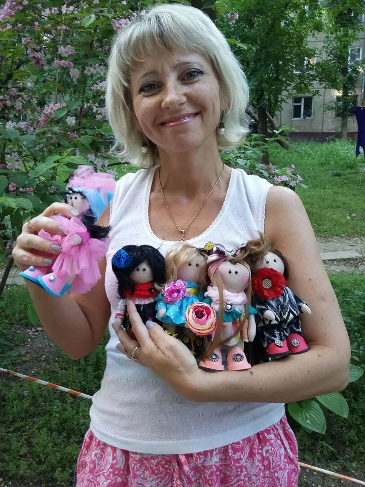 Doll Princess in the crown with an elephant in her hands, with yellow hair, beautiful, interior, birthday present, holiday