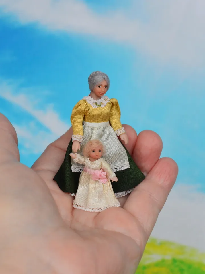 Miniature dolls in 24th scale. A grandmother with a baby for a dollhouse.