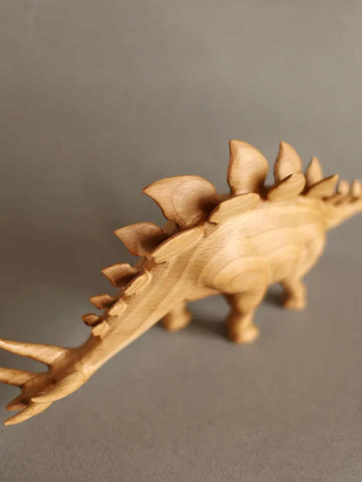 Wooden hand carved dinosaur stegosaurus
