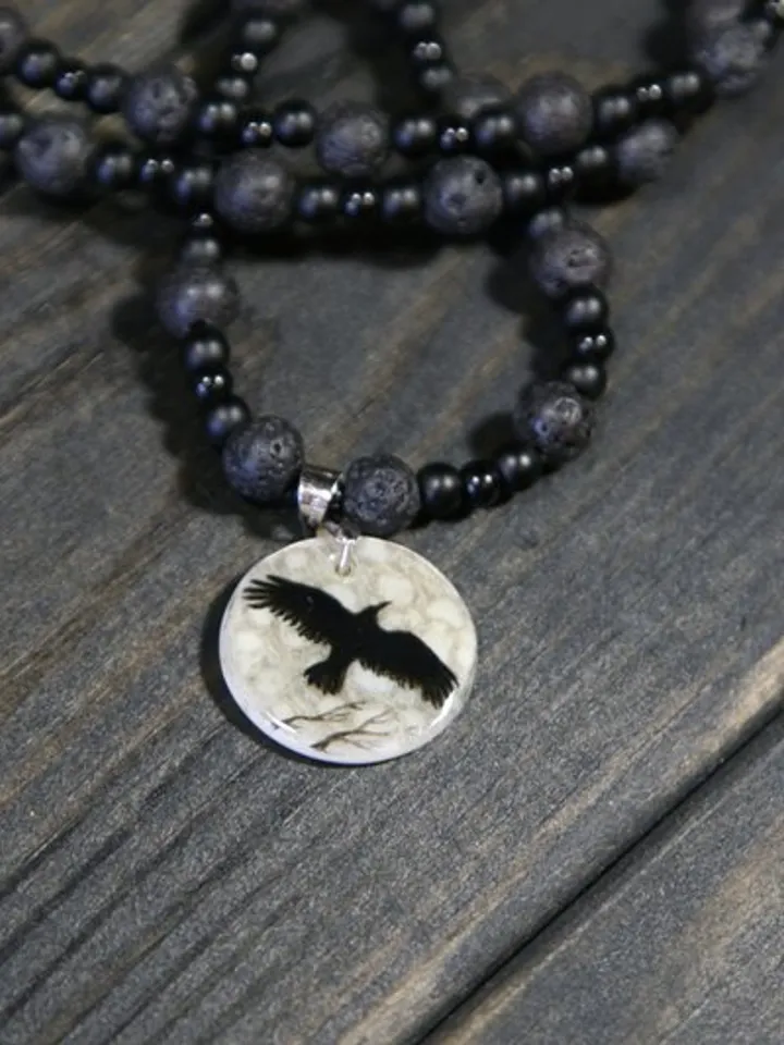 Raven or crow necklace with love rune on the other side. Nacre pearl pendant