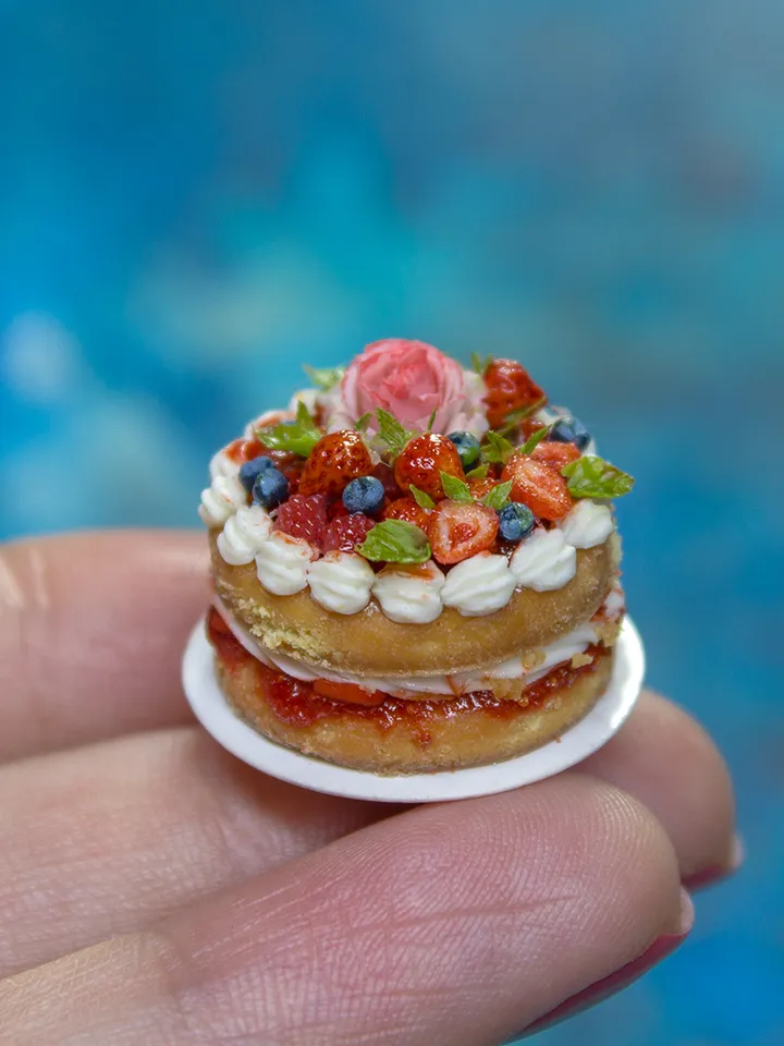 MINIATURE cake with rose and berries on a ceramic plate 2