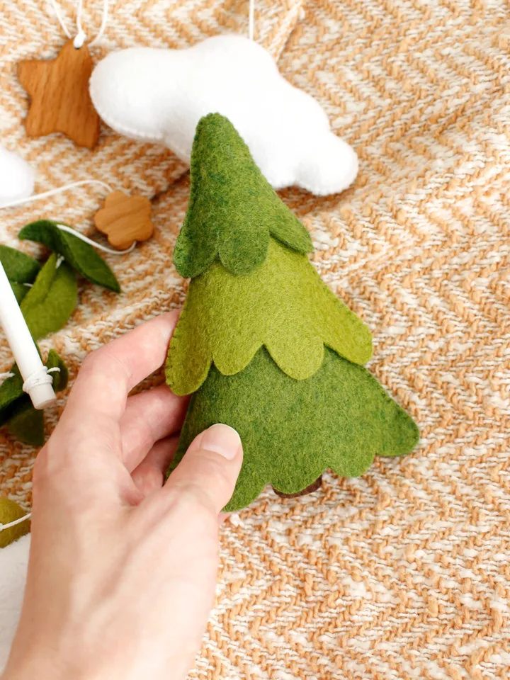 Felt woodland bear with clouds, spruce tree and mountain baby crib mobile hand sewing PDF tutorial with patterns. DIY forest nursery baby cot decoration