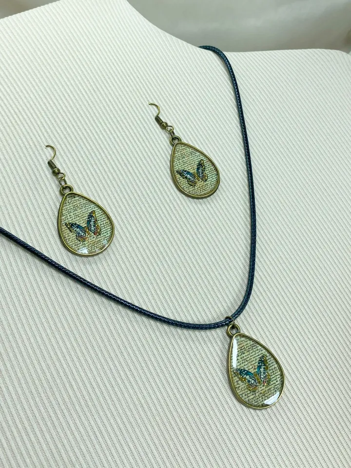 Handmade jewelry set. Shiny butterflies in a bronze frame. designer jewelry.