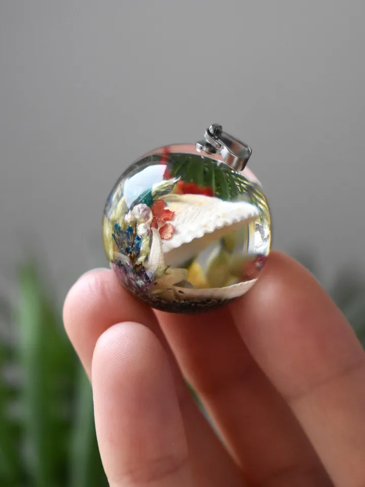 Shell with a pearl pendant. Sea pendant with shell, pearl and real flowers. Pinctada pendant.