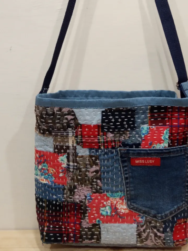 Pretty quilted handbag in the patchwork and boro style made of pieces of denim and cotton