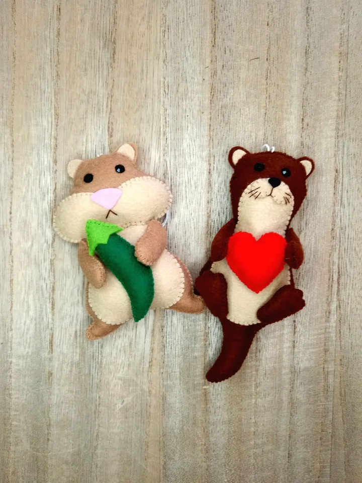 Felt otter. Otter with a red heart. Otter toy. New Year's decor otter. New Year's ornament otter