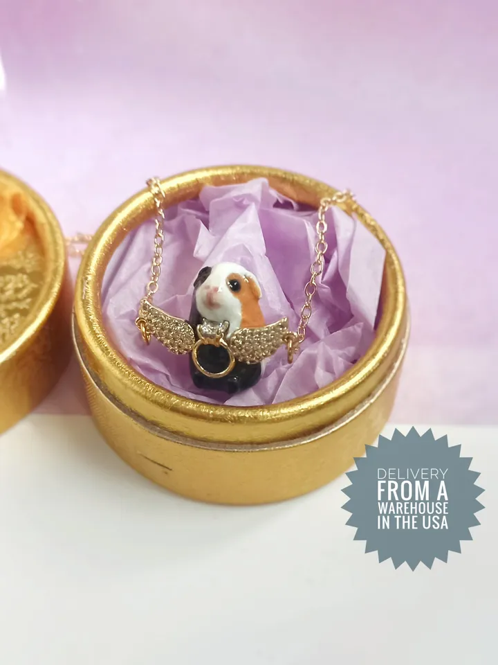 Handmade guinea pig pendant, adorned with rhinestones and gold wings (US discount)