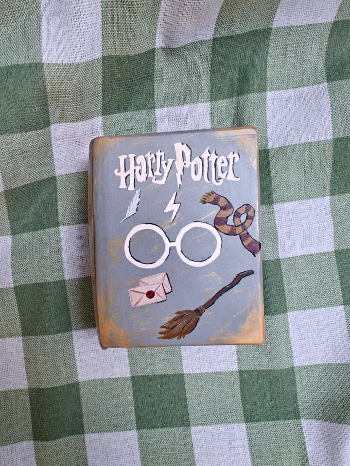 Candle in a plaster form of a book