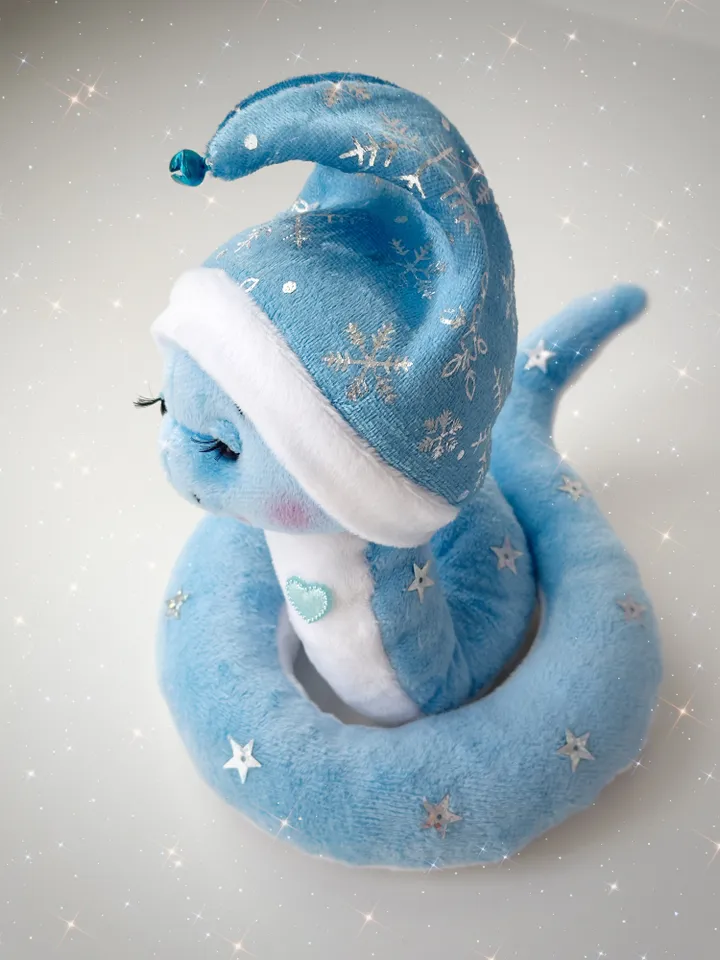 Christmas plush snakes. Handmade cute snakes in holiday hat for home decor. Christmas snakes for gift.