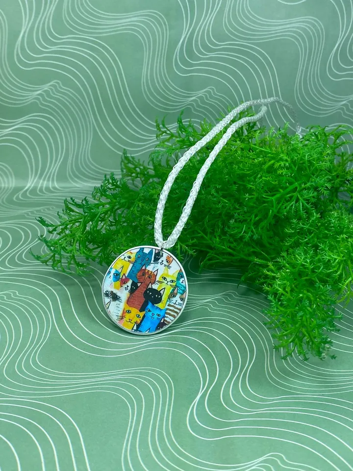 Pendant with kittens. Necklace. Handmade jewelry.Pendant on a cord. Author's design.