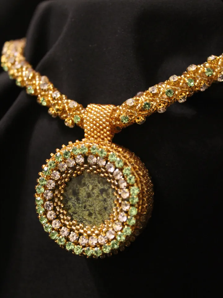 Pendant Japanese beads with a coil and rhinestones