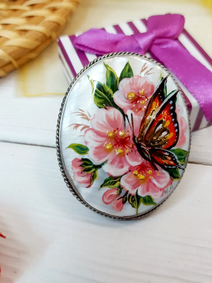 Brooches for women: A delicate butterfly on wild rose blossoms mother of pearl pin, hand painted pink floral brooch made from shell