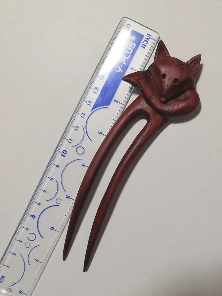 Carved wooden hairpin with a fox.