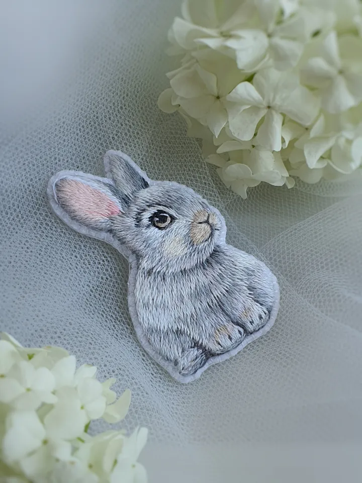 Tiny Bunny Brooch. An embroidered brooch in artistic satin stitch.