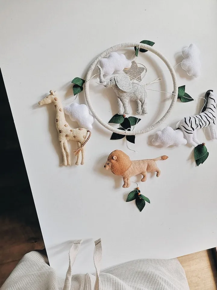 Safari mobile baby nursery decor crib
