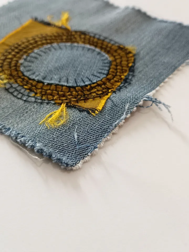 Upcycled denim boro patch. Sashiko stitching.