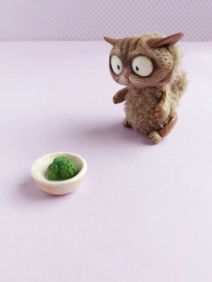 Discouraged cat doll