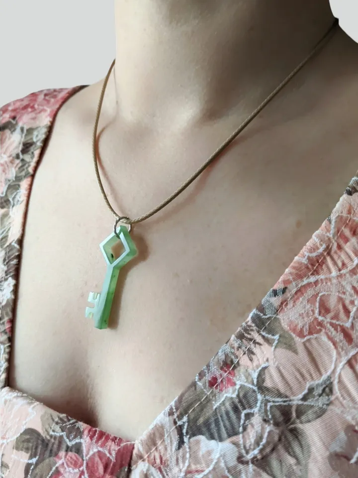 Skeleton green jade key good luck charm pendant.