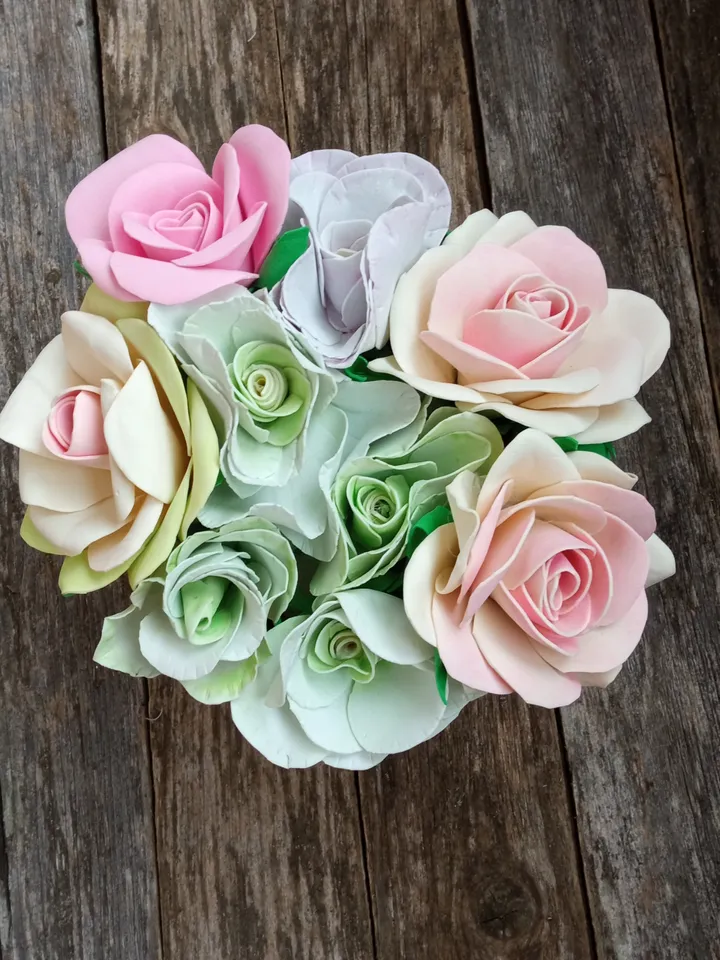 Beautiful composition of roses and eustomes in delicate colors. Handmade