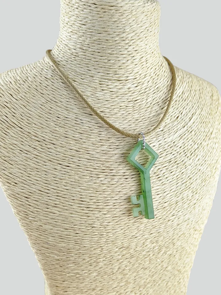 Skeleton green jade key good luck charm pendant.