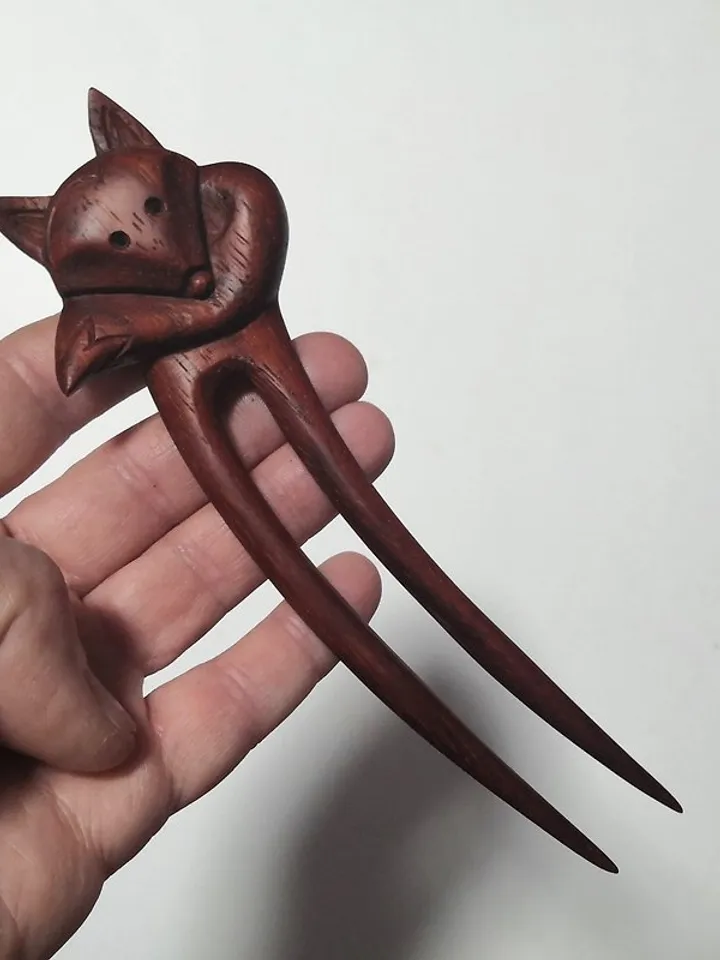 Carved wooden hairpin with a fox.