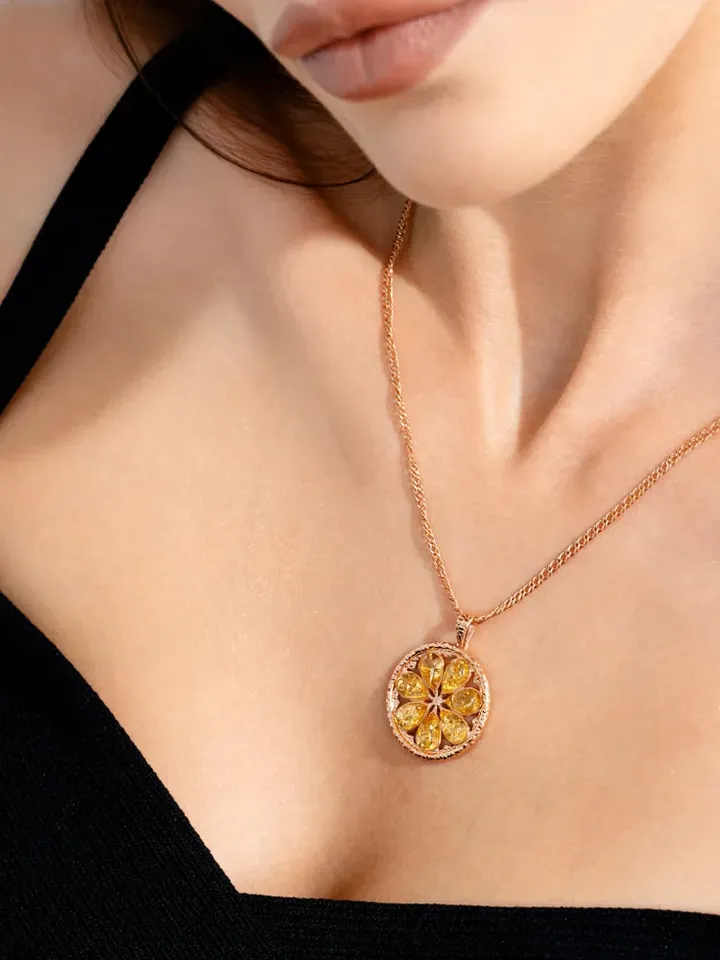 Jewelry pendant Lemons with natural Baltic amber made of 925 silver