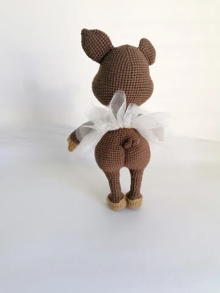 crocheted pig in the form of a ballerina.