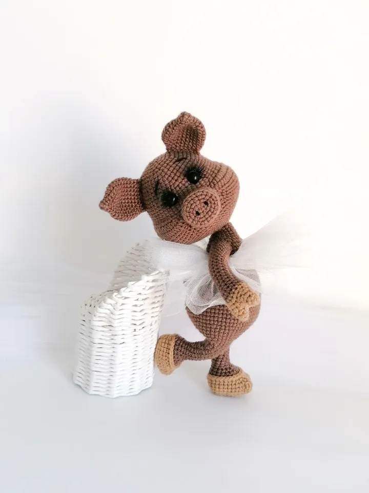 crocheted pig in the form of a ballerina.