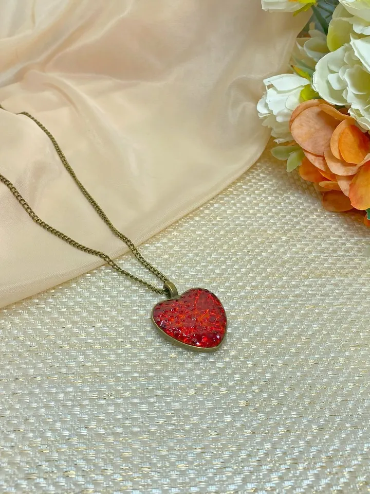 Pendant on a cord. Red heart. Handmade jewelry.3D effect.