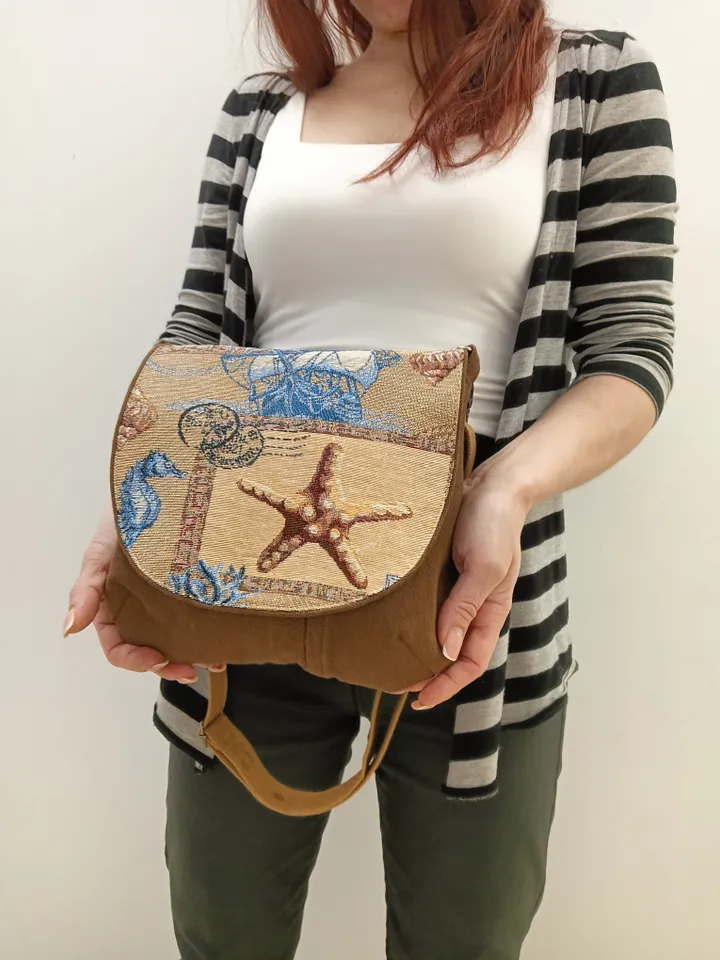Brown crossbody /shoulder denim bag, a women's messenger bag with a tapestry flap with a marine theme pattern and denim shoulder bag with 4 pockets inside and an adjustable strap.