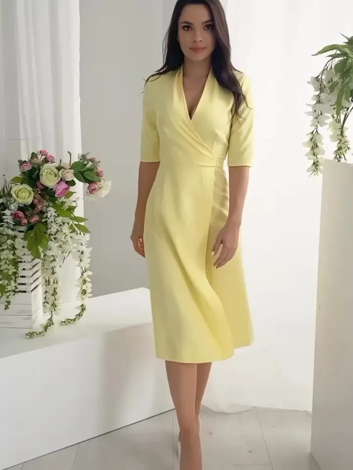 Yellow midi dress with a scent under the belt in stock