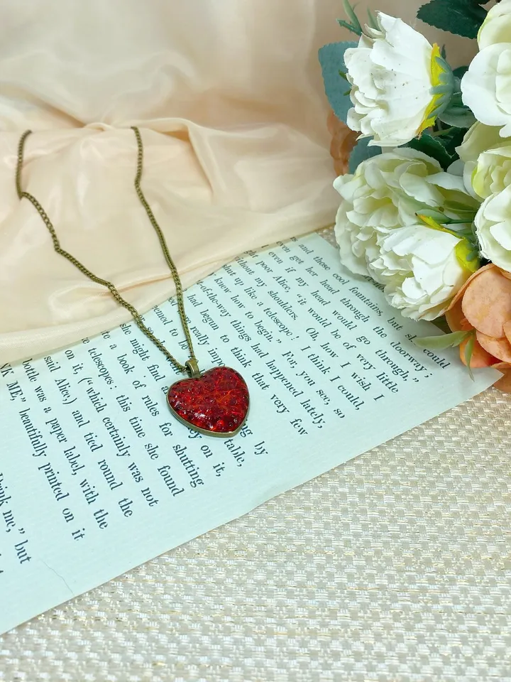 Pendant on a cord. Red heart. Handmade jewelry.3D effect.
