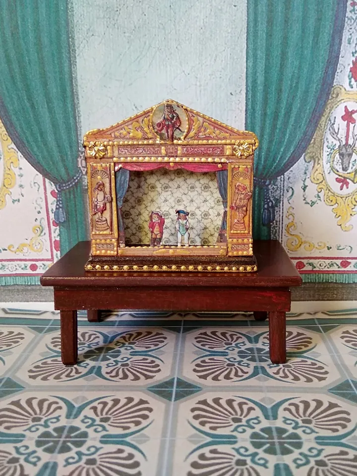 Miniature puppet theater for doll houses.
