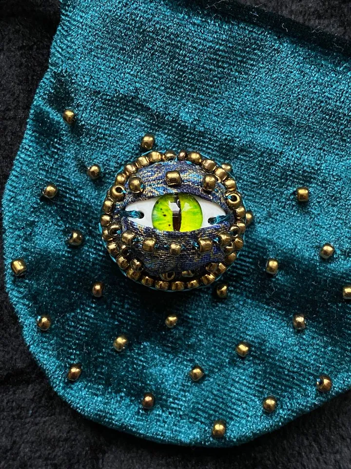 Green dragon eye brooch in walnut shell, green eye badge