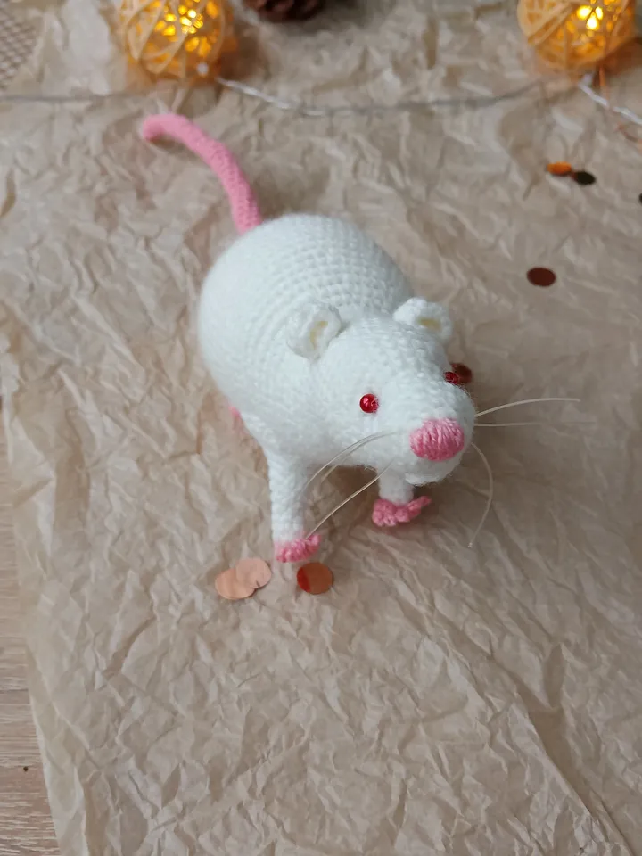 White mouse toy. Soft toy life-size white rat with red eyes.