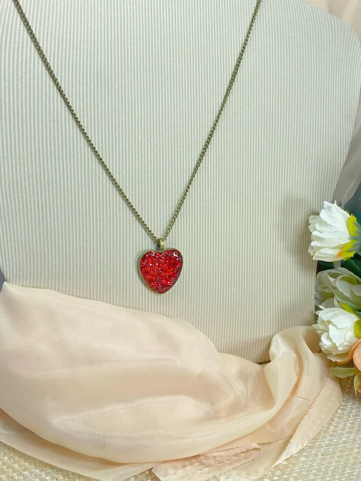 Pendant on a cord. Red heart. Handmade jewelry.3D effect.