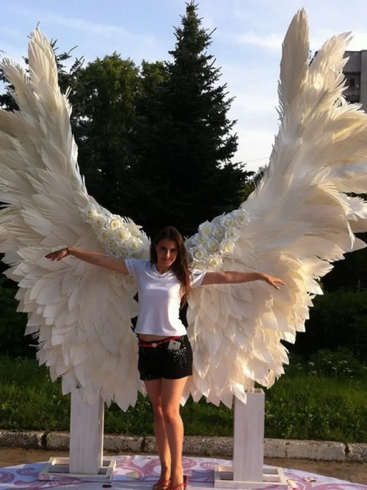 Giant angel wings wedding backdrop on metal stand, luxury street party decoration