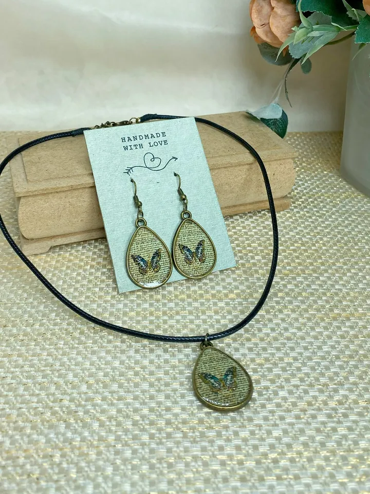 Handmade jewelry set. Shiny butterflies in a bronze frame. designer jewelry.